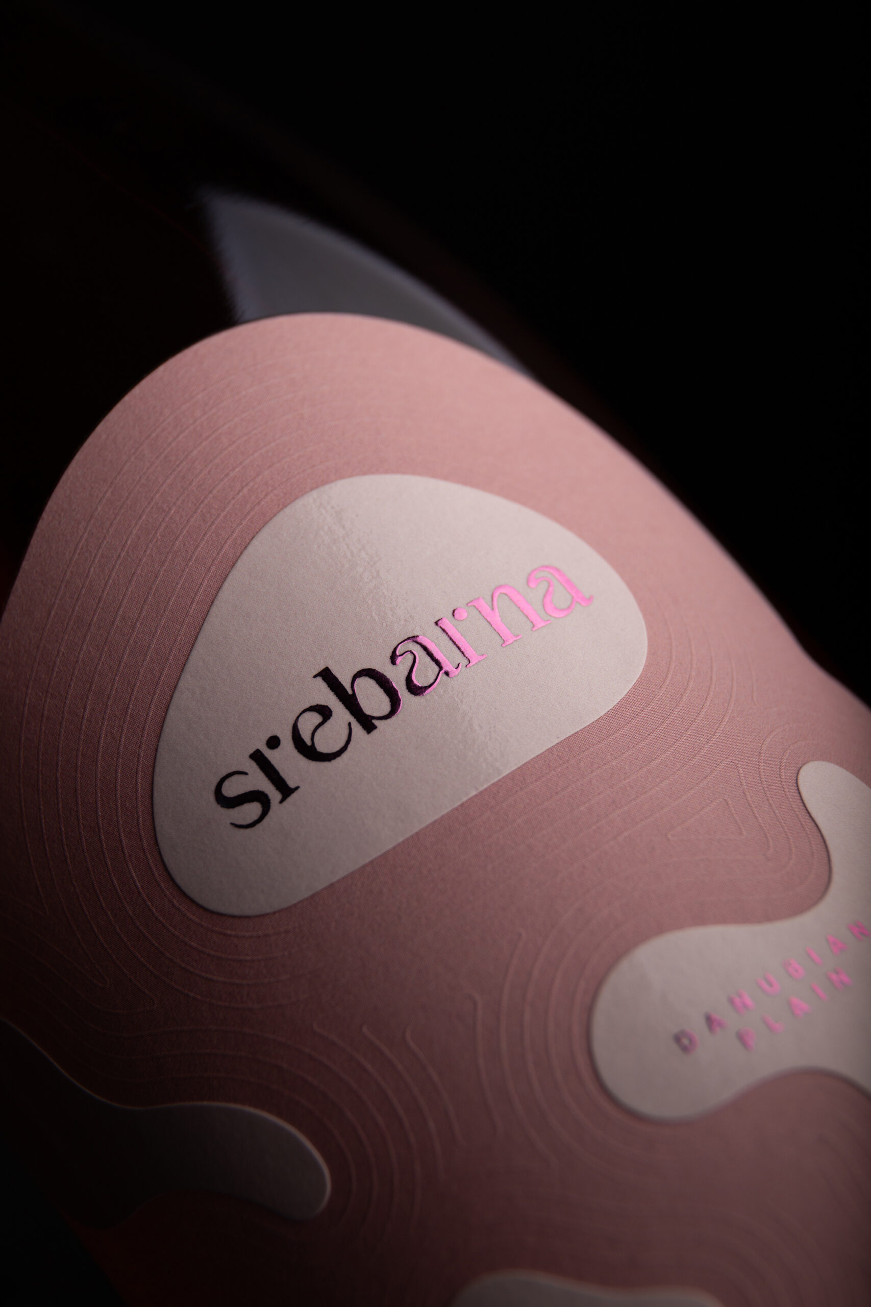 Srebarna Rosé wine label design photography — dual paper stock construction