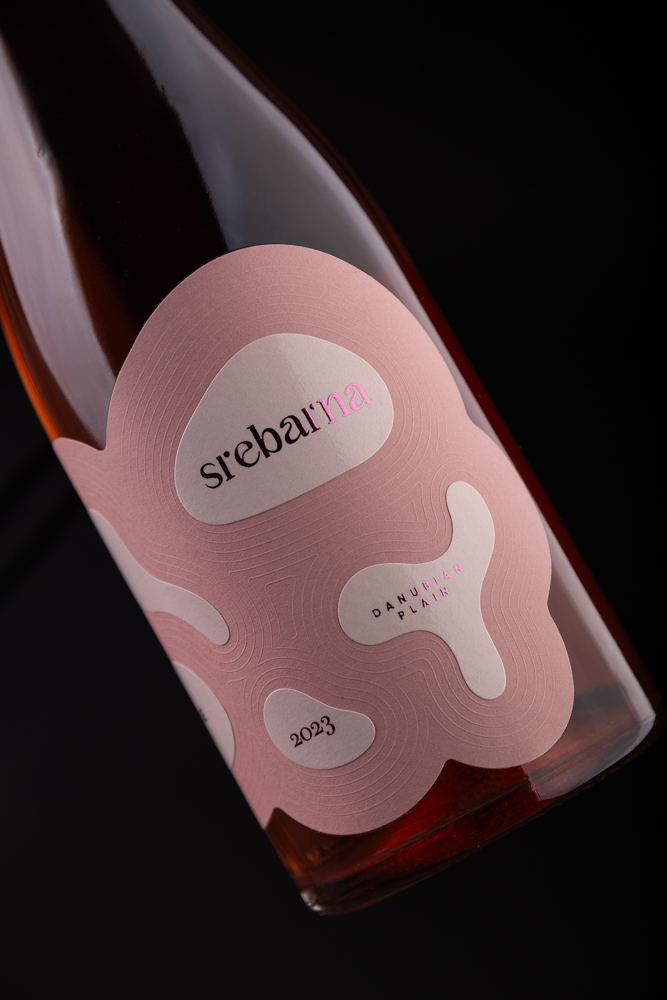 Srebarna Rosé wine label design detail showing embossed ripple pattern